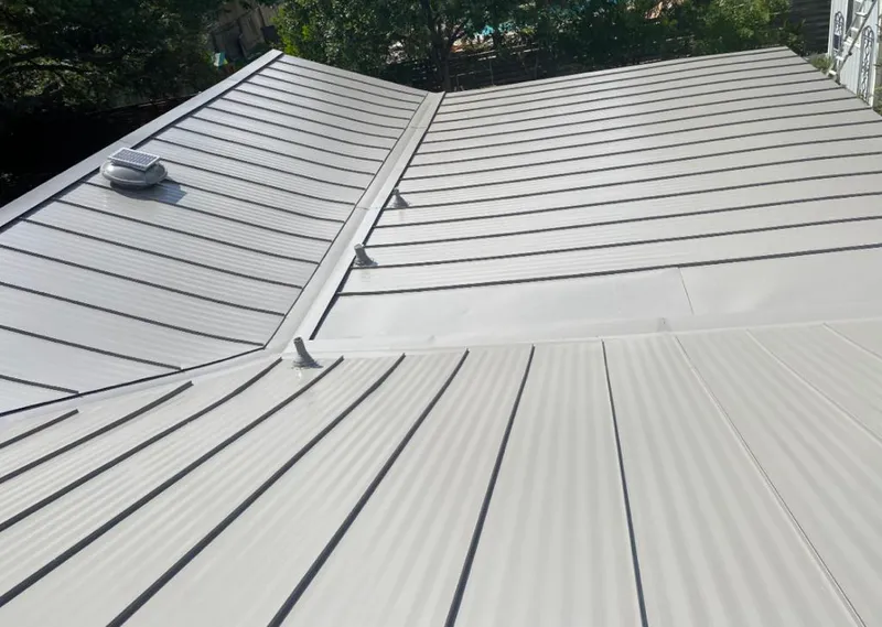 Solar attic fan installed on a metal roof for Roof Ventilation in Tucson Mountains